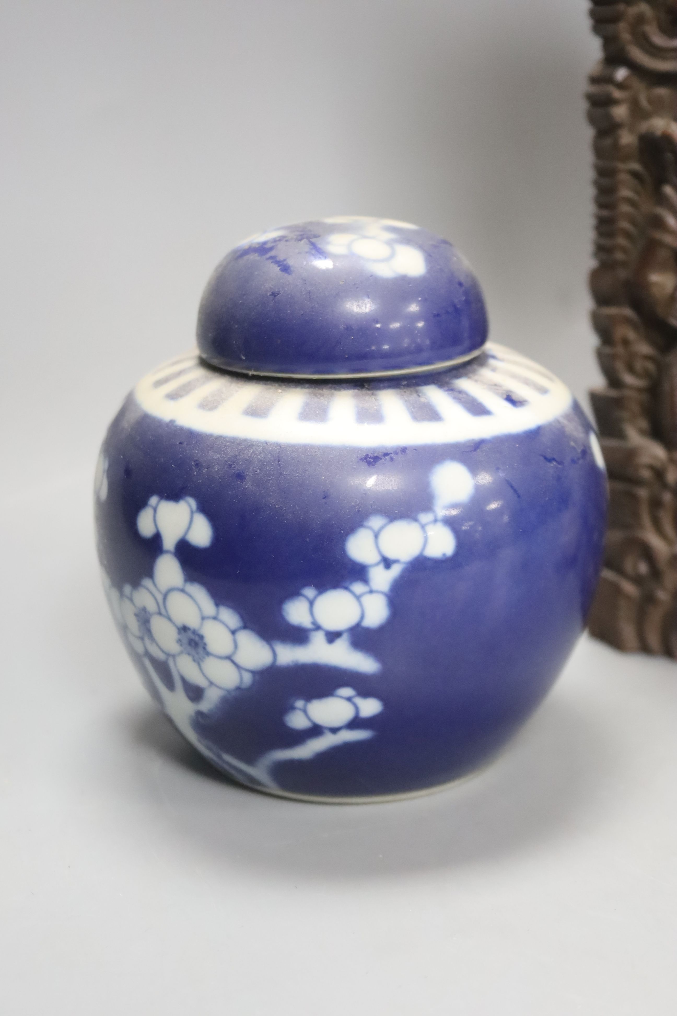 Two early 20th century Chinese blue and white jars, an agate miniature teapot and an Indonesian wood carving, length 27.5cm